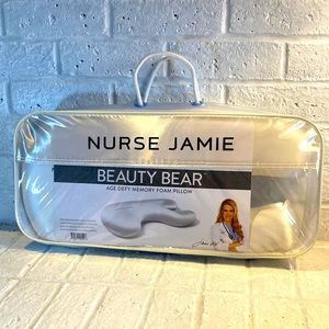New in package: Nurse Jamie beauty bear age defy memory foam pillow. Eyelashes